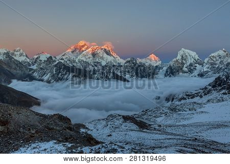 Sunset Over Everest Summit, View From Renjo La Pass. Breathtaking View Of Mountain Valley Covered Wi