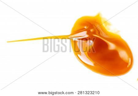 Caramel Sauce Isolated On White Background. Pouring  Toffee Sauce Spot