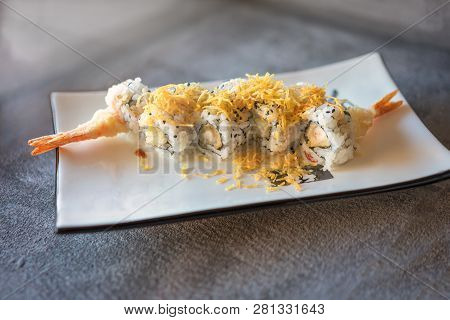 Shrips Sushi Served  On Rectangular White Plate On Dark Gray Stone Background