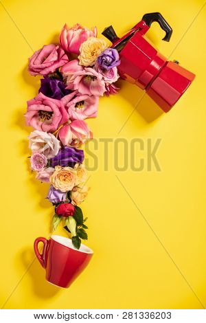 Morning coffee concept. Coffee maker, coffee cup and flowers. 