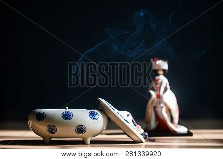 Close Up Of Japanese Incense Burner With Ceramic On Table