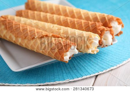 Gaufres de Montcuq, rolled wafers with cream filling  on a white dish