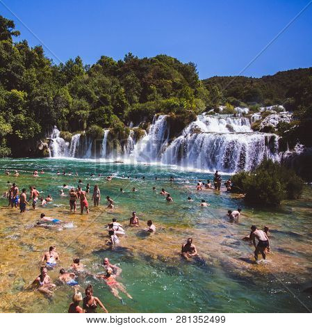Krka National Park, Croatia - Aug 13, 2015: Plenty Of Tourists Enjoy Swimin In Krka Waterfalls In Th