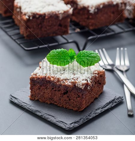 Homemade Brownie With Coconut Flakes, Swedish Dessert Karleksmums, Cut In Square Servings, On Stone 