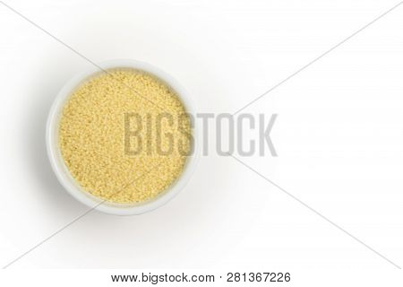 Dry Couscous In White Ceramic Bowl Isolated On Grey. Spilled Couscous.