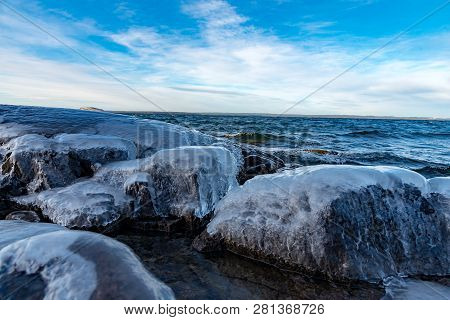 Icy Stones On Beach Near Lake Vattern