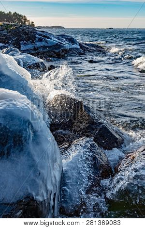 Icy Stones On Beach Near Lake Vattern