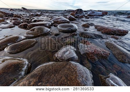 Icy Stones On Beach Near Lake Vattern