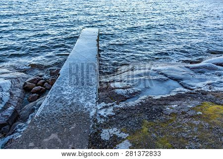 Jetty Full Of Ice In A Lake