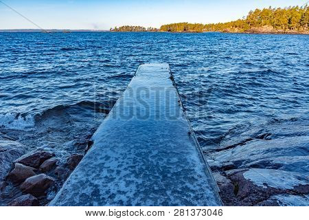 Jetty Full Of Ice In A Lake