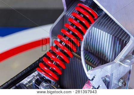 Red Motorcycle Shock Absorbers A Device For Absorbing Jolts And Vibrations.
