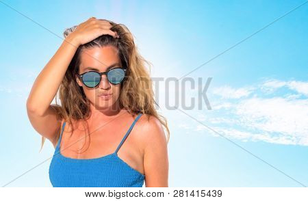 woman sunbathing on the beach summer travel holidays