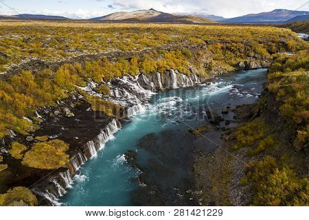 Aerial View Of Autumn Foliage At Hraunfossar Waterfalls In Husafell, West Iceland
