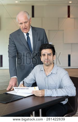 Entrepreneur Is Unhappy With Work Of His Employee. Young Businessman Working Under Control Of His Bo