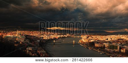 Storm Clouds Dramatic Sky Over City Budapest, Hungary. Bridge Overt The Danube River.