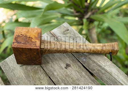 Mallet Hammer Made Of Burl Wood Tools For Used By Carpenter In Workshop On Isolated Blurred Backgrou