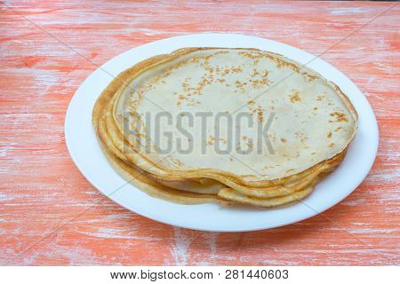 Fried Tasty Thin Slapjack On Wooden Background