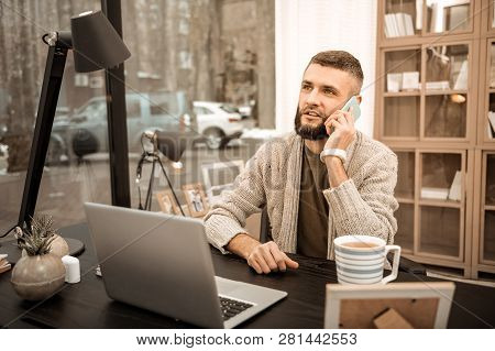 Self-employed Businessman Talking On His Mobile Phone