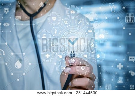 A Closeup Of A Doctor Touching A Composite System Of Medical Icons With Different Symbols And Qualit
