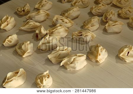 Kyrgyz Ravioli, A Woman Doing Ravioli, Meat Ravioli, Pasty Woman Who.make Ravioli With Dough.
