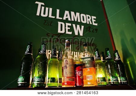 Kyiv, Ukraine - January 20, 2018: Tullamore Dew Whiskey With Carlsberg Beer Bottles On The Wooden Sh