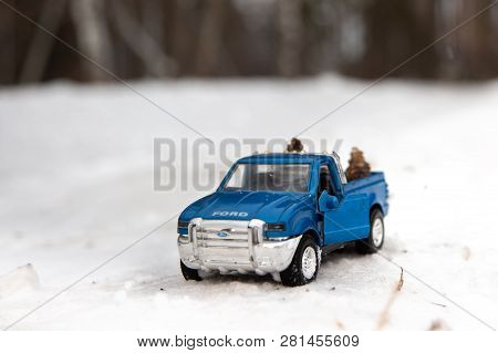 Moscow. December 2018. Blue Toy Pickup Truck Ford F350 With Open Door. Standing On Winter Snowy Road