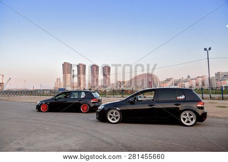 Moscow. Autumn 2018 2 Black Volkswagen Golf Tuning. Air Suspension, Orange Wide Wheels And Polish Ri