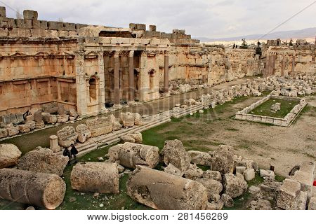 Baalbek - Ruins Of The Great Court Of The Ancient Phoenician City With Range Of Mountains At The Bac