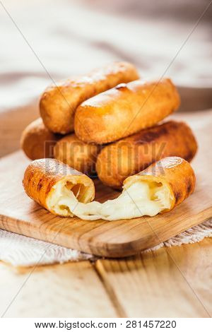 Cheese Fingers, Typical Venezuelan Appetizer Called Tequeños  On A Wooden Board