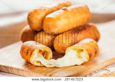 Cheese Fingers, Typical Venezuelan Appetizer Called Tequeños  On A Wooden Board