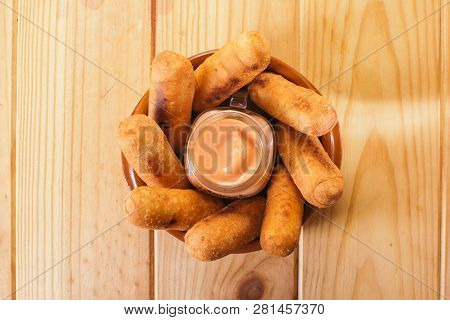 Top View Of Latin-american Appetizers Called Tequeños Made Of Fried Corn Filled With Cheese With A P