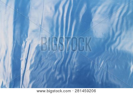 Blue Texture Of Plastic (latex) With Reflections And Bubbles, Similar To The Sea Texture. Background