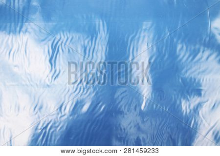 Blue Texture Of Plastic (latex) With Reflections And Bubbles, Similar To The Sea Texture. Background