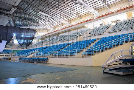 Puerto Princesa, The Philippines - 27 Nov 2018: Empty Stadium With Plastic Chairs And Stage. Sport C