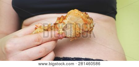 Fat Woman Holding And Eating Fried Chicken. Food And Healthcare Concept