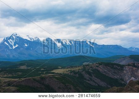 Summer in Kurai steppe and North-Chui ridge of Altai mountains, Russia. Cloud day.