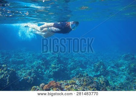 Young Woman Snorkeling Underwater Photo. Snorkel In Coral Reef Of Tropical Sea. Young Girl In Fullfa