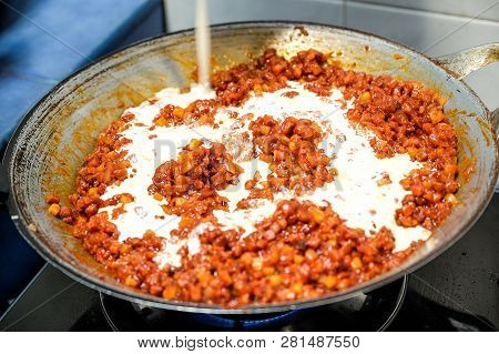 Cooking Pork With Bbq Sauce And Diced Waternuts