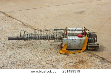 Fogging Machine On Ground To Fog With Insecticides For Kill Aedes Mosquito, Carrier Of Dengue Virus 
