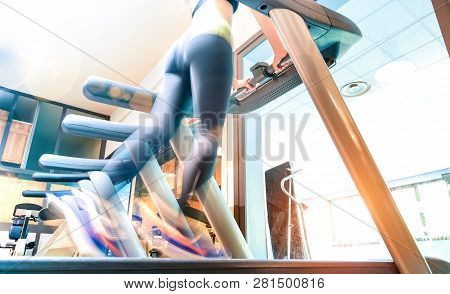Low Section View Of Active Sportswoman Running On Treadmill At Gym Fitness Studio - Healthy Lifestyl