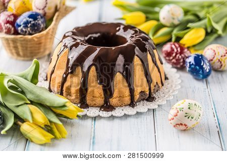 Delicious Holiday Slovak And Czech Cake Babovka With Chocolate Glaze. Easter Decorations - Spring Tu