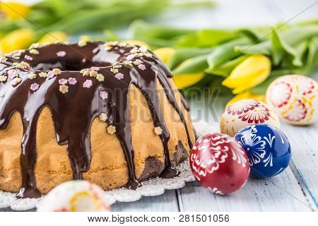 Delicious Holiday Slovak And Czech Cake Babovka With Chocolate Glaze. Easter Decorations - Spring Tu