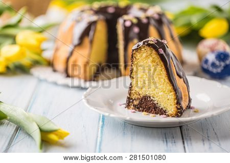 Delicious Holiday Slovak And Czech Cake Babovka With Chocolate Glaze. Easter Decorations - Spring Tu