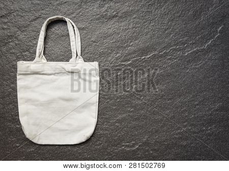White Tote Canvas Fabric Eco Bag Cloth Shopping Sack On Dark Background / Zero Waste Use Less Plasti