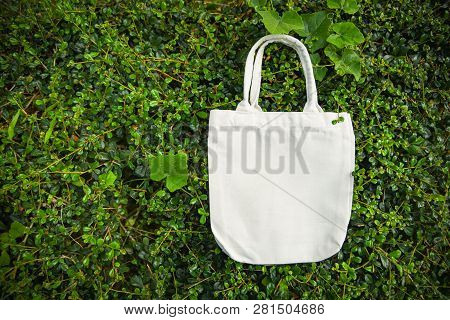 White Tote Canvas Fabric Eco Bag Cloth Shopping Sack On Green Leaf Nature Background / Zero Waste Us