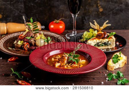 Concept Of French Cuisine. Laid Table In A Restaurant For A Celebration Of Different Dishes. Backgro