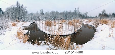 The First Snow On The Bank Of The Lubya River .winter Landscape.panorama. Russia, Leningrad Region. 