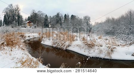 The First Snow On The Bank Of The Lubya River .winter Landscape. Panorama.russia, Leningrad Region. 