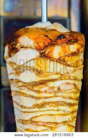 Doner Kebab Bbq Made Of Meat Cooked On A Vertical Rotisserie - Traditional Turkish Dish That Is Eate