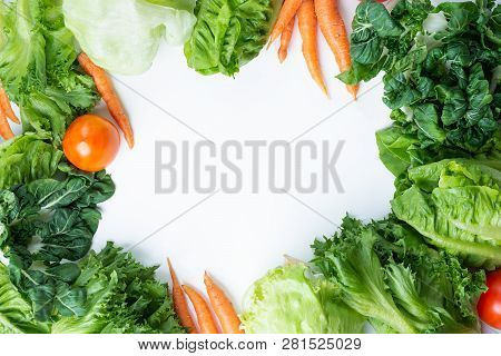 Fresh Green Lettuce Salad And Carrot, Tomato, Vegetables On White Background, Top View With Coopy Sp